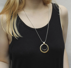 Cutout Disc with Ring and Bead Necklace